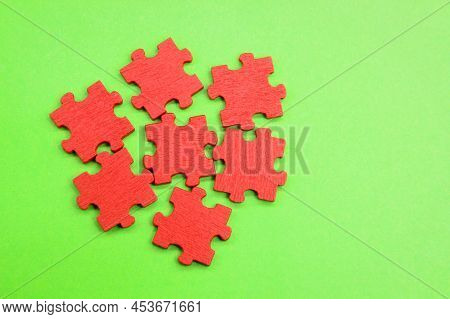 Puzzles Not Yet Listed. Unresolved Colored Wooden Puzzle Pieces