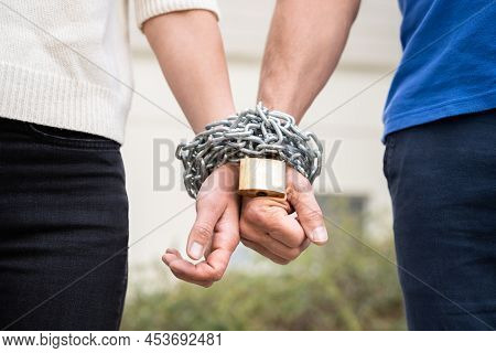 Couple Codependent Relationship. Partner Hands Chained Together