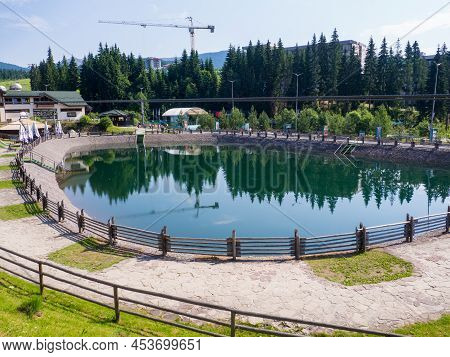 Bukovel, Ukraine - June, 2021: Sights Of The Modern Popular Ski Resort Of Bukovel. Empty Lake In Buk