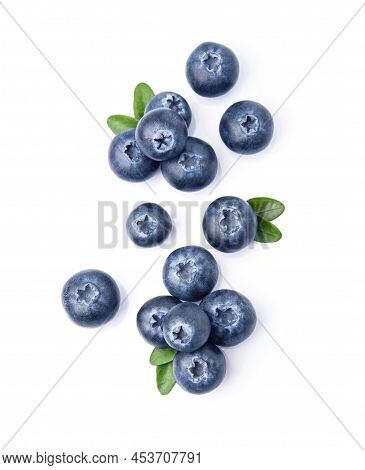 Blueberries With Leaves Closeup On White Backgrounds. Flat Lay