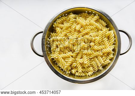 Boiled Vermicelli Noodles Horns In A Colander