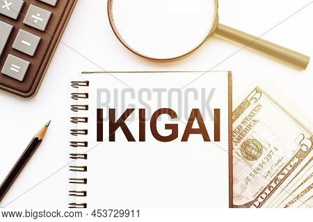 Ikigai Text On The Book Isolated On Office Desk Background. Japanese Concept