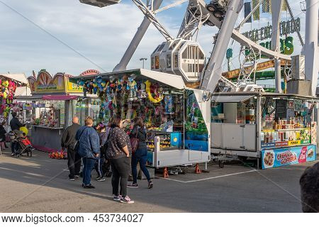 Palma De Mallorca, Spain; April 08 2022: Attractions And People At The Traditional Annual Fair, Fira