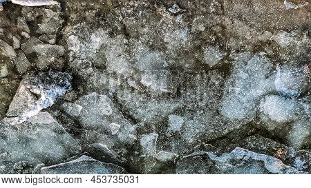 Transparent Ice Floating On The Waves In The River Near The Shore In Winter Background