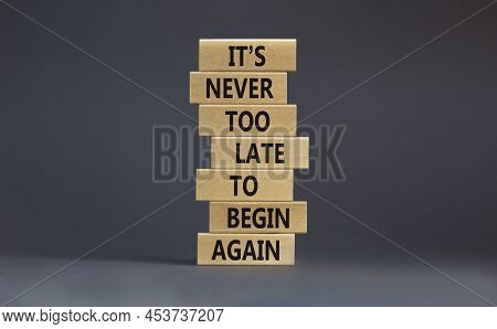 Begin Again Symbol. Wooden Blocks With Words 'it Is Never Too Late To Begin Again'. Beautiful Grey B