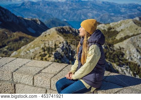 Woman Traveller In Mountain Landscape At National Park Lovcen, Montenegro. Travel To Montenegro Conc