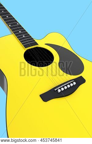 Close-up Of Acoustic Guitar Isolated On Blue Background.