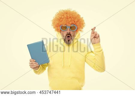 Superstitious Idea. Superstitious Man Hold Book. Keeping Fingers Crossed For Luck