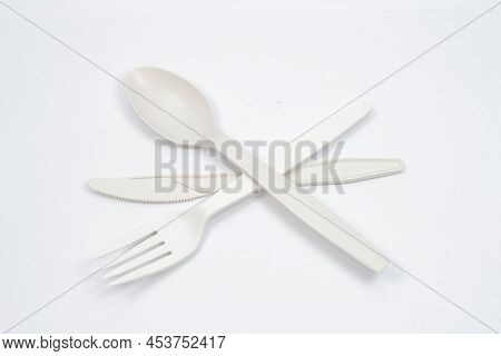 A Set Of Fork, Kinfe And Spoon On White Board