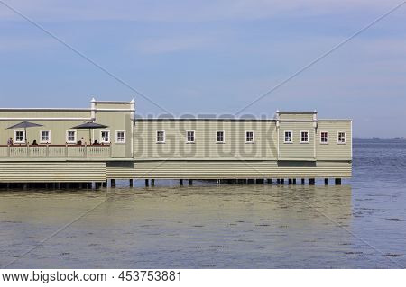 Malmo, Sweden - June 24, 2019:  Ribersborgs Open-air Bath Also Known As Ribban, People Sitting On Th