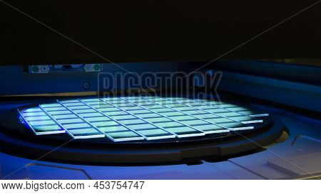 Silicon Wafer With Chips In Uv Lighting. Neon. Ultraviolet Lithography.