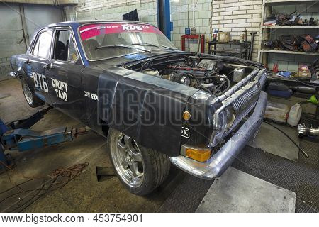 Saint Petersburg, Russia - April 08, 2022: Black Custom Volga Gaz-24 In Car Service