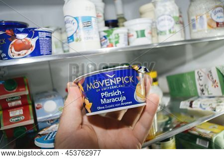 Paris, France - Jan 1, 2011: Pov Male Hand Holding Package With New Plastic Movenpick Of Switzerland