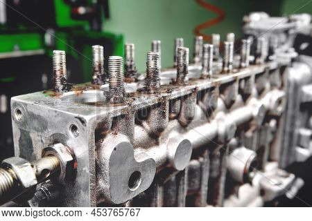 Car Fuel Pump Repair, Auto Fuel Pump Disassembly For Repair, Old Car Fuel Pump On A Workbench, Disas
