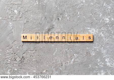 Millennials Word Written On Wood Block. Millennials Text On Table, Concept.