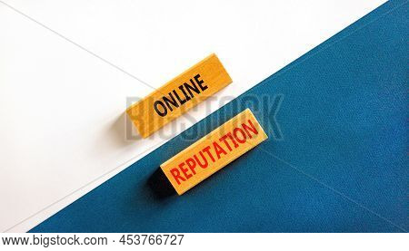 Online Reputation Symbol. Wooden Blocks With Concept Words Online Reputation On Beautiful White And 