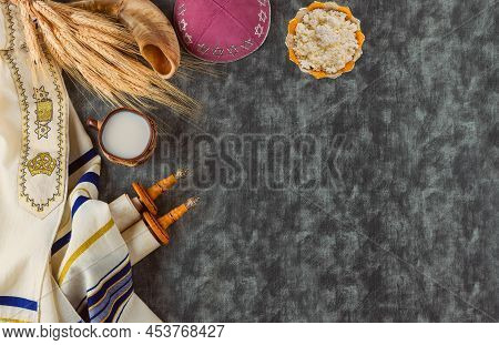 Symbols Of Jewish Holiday Shavuot Torah And Shofar, Wheat On Old Red Background.