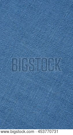 Blue Woven Surface Close-up. Linen Textile Texture. Graceful Color Fabric Background. Vertical Textu