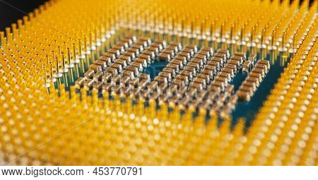 Computer Hardware. Processor Lies On Dark Matte Surface. Cpu, Semiconductors, Pins And Connectors. E