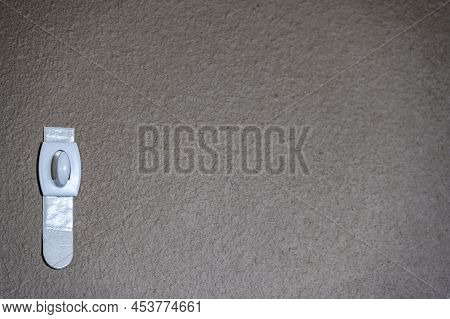 Selective Focus On Adhesive Strip Wall Hanger That Can Be Removed By Pulling Tape