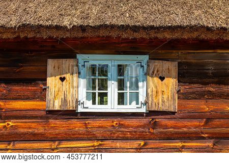 Thatched Cottage With Wooden Shutters In Open-air Museum, Kashubian Ethnographic Park.