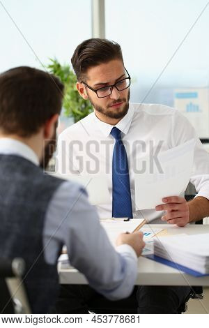 Portrait Of Coworkers Men Working At Financial Papers, Solve And Discuss Problems. Businessmen Analy