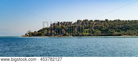Italy, Sirmione Peninsula, The Ruins Of The Catullus Roman  Villa Seen From The Garda Lake
