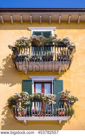 Italy, Bardolino, Detail Of  Balconies Full Of Flowers In The Old Town
