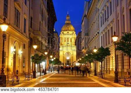 Zrinyi Utca Street And Saint Stephen`s Basilica In Budapest At Night. Hungary.