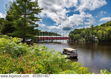 Wakefield, Quebec, Canada - August 30, 2021: Wakefield Covered Bridge Crossing The River Gatineau. W