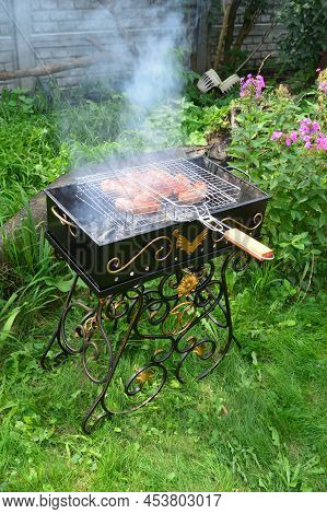Metal Grill For Grilling Kebabs And Steaks. Selective Focus