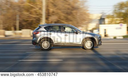 Fast Moving Silver Mazda Cx-5 On Speedway Road. Overspeed In City Concept. Suv Car On City Road In M