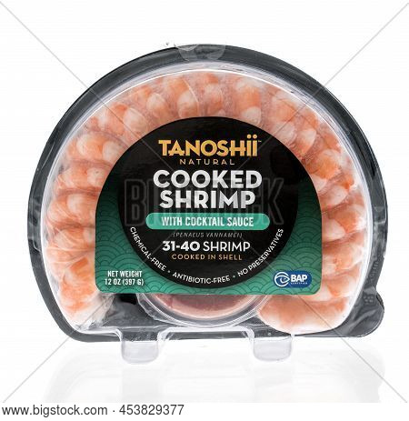 Winneconne, Wi -23 April 2022: A Package Of Tanoshii Cooked Shrimp With Cocktail Sauce On An Isolate