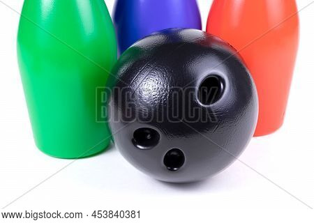 Set Of Collored Bowling Pins And Ball Isolated On A White Background. Skittles Isolated On A White B