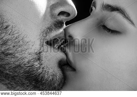 Sensual Couple In Love Kissing. Intimate Relationship And Sexual Relations. Closeup Mouths Kiss. Pas