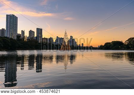 Igapo Lake At Sunset During Christmas, Londrina - Pr, Brazil. Beautiful City Lake With Christmas Tre