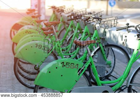 Castellon, Spain, Close Up Of Rental Bicycle Alignment Parked At The Station In The Street. High Qua