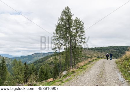 Hiker On The Trail To Platsch Cabin In Ramingstein, Lungau, Austria