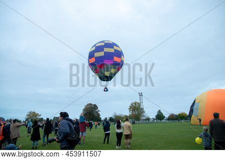 Masternon, New Zealand April, 22 2022 - People Attending Hot Air Balloon Festival In Masterton New Z