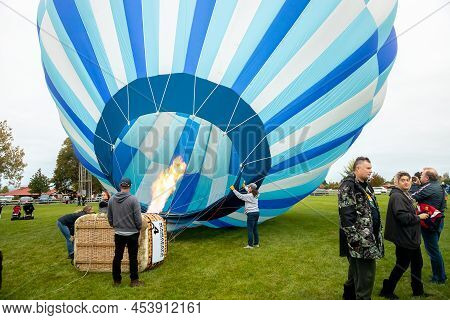 Masternon, New Zealand April, 22 2022 - People Attending Hot Air Balloon Festival In Masterton New Z