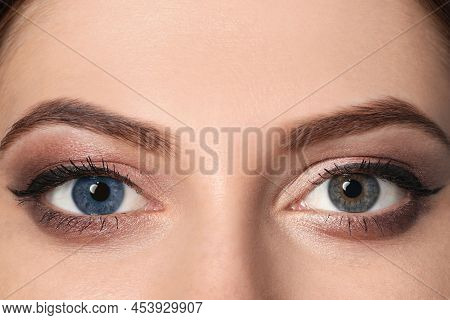 Woman With Different Colors Of Eyes, Closeup. Heterochromia Iridis