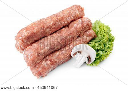 Raw Traditional Romanian Meat Rolls Mititei Over White Background.