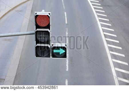 Green And Red Traffic Lights Over Empty Multiband Highway