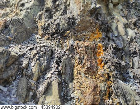 Geodesy. Stone Texture. The Rock Is Brown And Red. Mineral Background. Design From Natural Materials