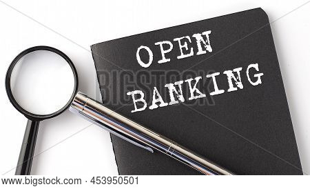 Open Banking - Business Concept, Magnifier With White Text Message On A Black Notebook