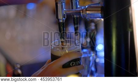 Draw A Fresh Guinness Beer In A Pub - City Of Dublin, Ireland - April 20, 2022