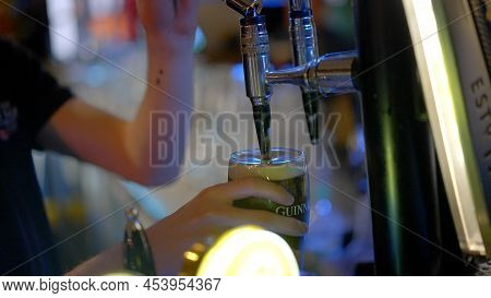 Draw A Fresh Guinness Beer In A Pub - City Of Dublin, Ireland - April 20, 2022