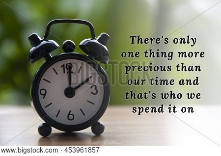 Inspirational Quote Text With Black Alarm Clock Background. The Clock Set At 2 O'clock, Motivational