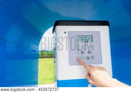 Automatic Tire Inflator. Hand Press Touch Screen Button On Digital Display Of Automatic Tire Inflato