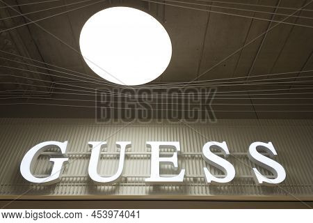 Guess Brand Logo Sign On Clothing Store In Vilnius, Lithuania, April 27, 2022. Guess Is American Clo